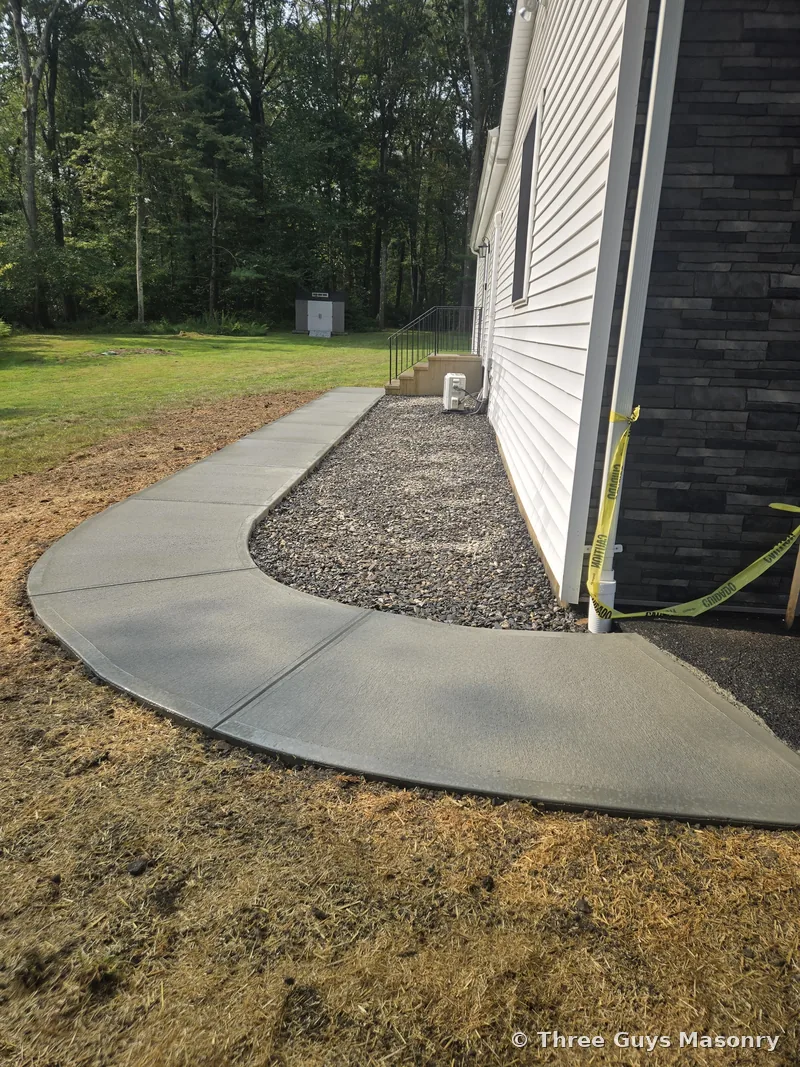 Concrete walkway poured by Three Guys Masonry in Connecticut
